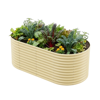 Land Guard 36" Tall 8' x 4' Oval galvanized metal raised garden bed in Cream planted with vegetables and flowers