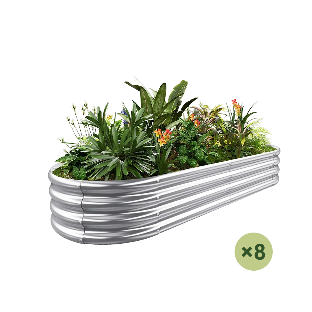 Galvanized metal raised garden bed filled with lush plants and colorful flowers. Includes "x8" indicator.