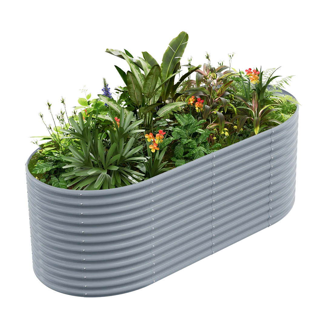 Oval corrugated metal raised garden bed filled with lush green plants and vibrant orange and red flowers.