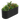 Black corrugated metal raised garden bed with lush plants and flowers.